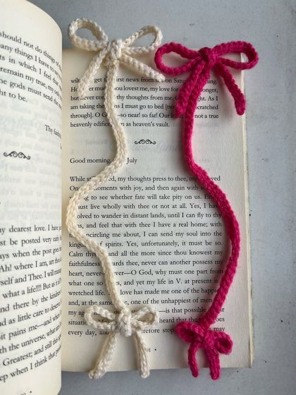 My double-ended coquette bow bookmarks, shown here in cream and magenta. This design features a bow at each end, ensuring your bookmark looks cute from every angle.
