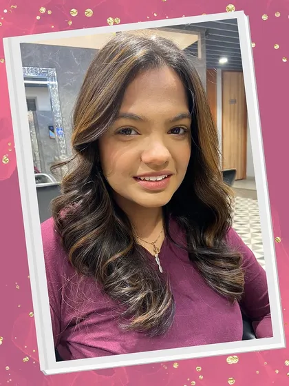 A close-up of the finished balayage, showcasing the seamless blend of colors and the healthy shine of the hair after our treatment and styling.