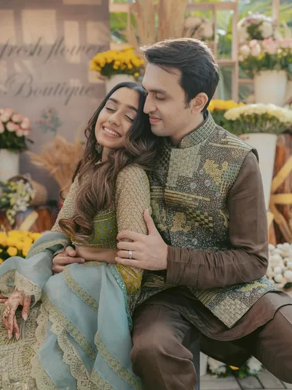 A tender moment between the couple at their Mehendi. We create a cozy and romantic atmosphere, capturing their connection amidst the beautiful floral decor.