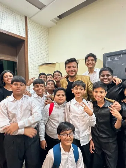 A backstage photo with some of the talented students from the 'SuperStan Musical'. The excitement and camaraderie behind the scenes are just as important as the performance itself.