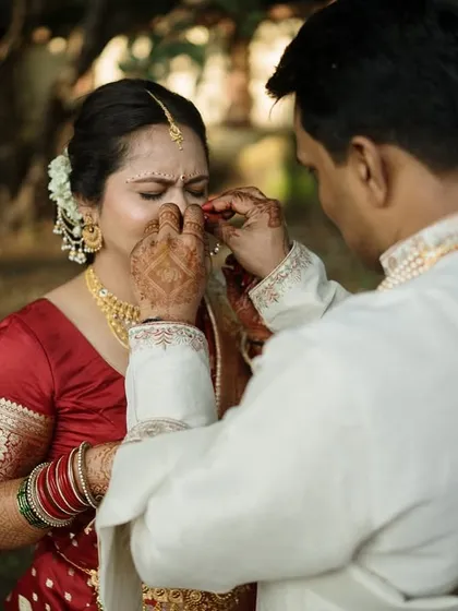 An emotional moment of the groom gently wiping a tear from the bride's eye. These are the tender, unscripted gestures that reveal the depth of a couple's love.