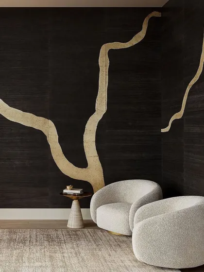 Infused with the essence of Kintsugi, our Adorn wallcovering by Phillip Jeffries channels strength and uniqueness. The large-scale golden repair motif on a dark, textured background creates a space of timeless beauty.