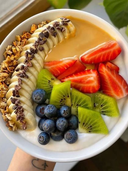 Another look at our beautiful and nutritious fruit smoothie bowl, showing the fresh ingredients and careful presentation.