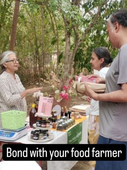 A vendor and customers in conversation, showing the strong bond between producers and consumers.