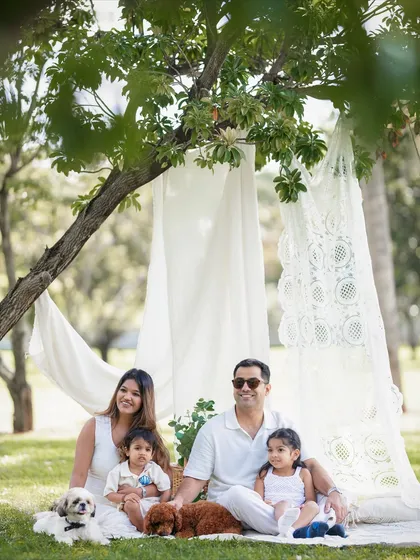 A classic family portrait where everyone is looking at the camera. Even with a posed shot, I aim for a relaxed and happy feeling.