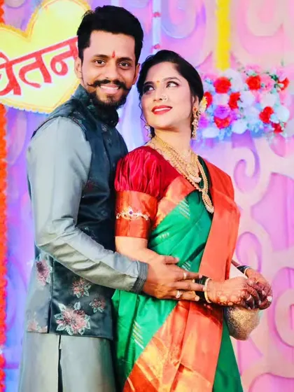 A sweet moment between the engaged couple, their smiles telling a story of love.