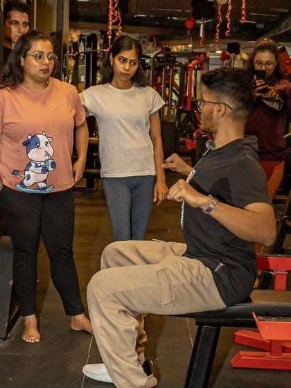 Demonstrating proper bench press setup during a workshop. I believe in educating athletes, so they understand the mechanics of each lift and can become smarter lifters themselves.