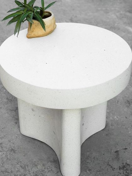 Another angle of the terrazzo coffee table, showing its polished top and sturdy, sculptural base. This piece is a great example of our custom-made furniture, designed to be both beautiful and durable.