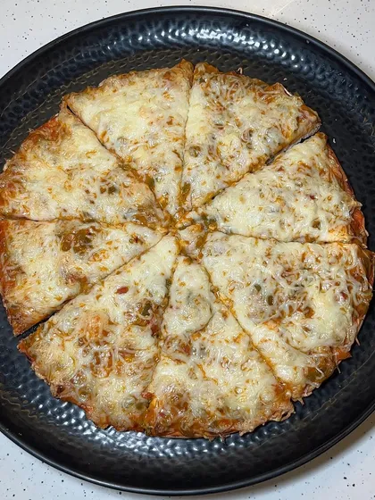 My Melting Cheese Pizza, a simple yet delicious pizza with a generous layer of melted cheese.