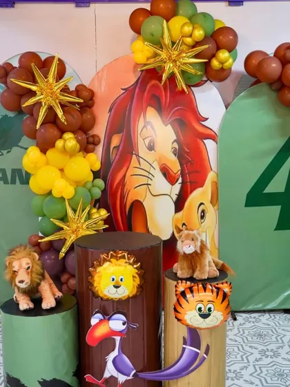 A detailed look at our Lion King themed cake-cutting area. We use character props, themed pedestals, and jungle-inspired balloons to make the moment special.