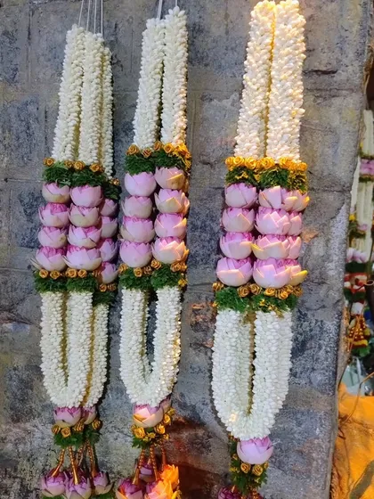 Exquisite wedding garlands made from jasmine and lotus buds, handcrafted for the special day.