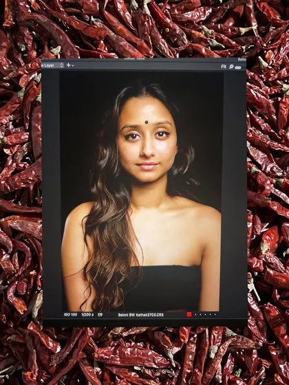A creative portrait that reflects my connection to my Indian roots. The bindi and the backdrop of red chillies represent the spice and spirit that I bring to my art and my life.