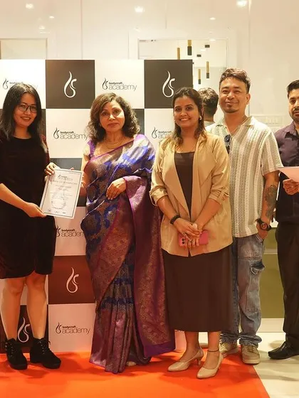 A student receives her certificate on stage during our launch event. We take every opportunity to celebrate the hard work and success of our students.