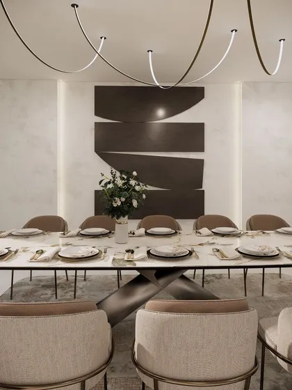 This futuristic dining space concept features a long marble table set for twelve. The minimalist chairs and unique, flowing overhead lights create a vision of how we will gather and dine in the years to come.