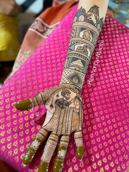 A detailed story mehendi showing various wedding rituals and figures. Each panel on the arm tells a different part of the wedding story.