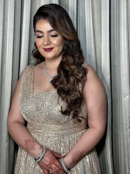 A close-up of the reception makeup. The combination of a smokey eye and red lip is timeless and glamorous.