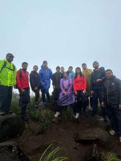 Our group at the summit of Kurinjal peak on a foggy day. Reaching the top together is always a moment of celebration.