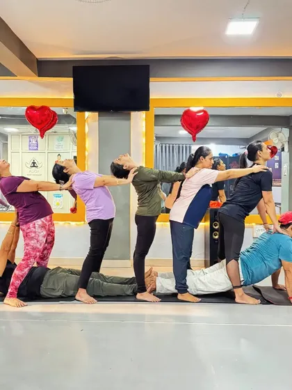Teamwork and connection are at the heart of a healthy workplace. This creative group pose is more than just a physical exercise; it's a fun activity that builds trust, encourages collaboration, and leaves everyone feeling energized and united.