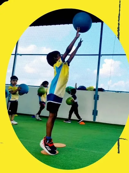Reaching for new heights. This action shot captures the athleticism and determination I aim to foster in every child. We focus on building not just athletic ability, but also the confidence to try hard and aim high.