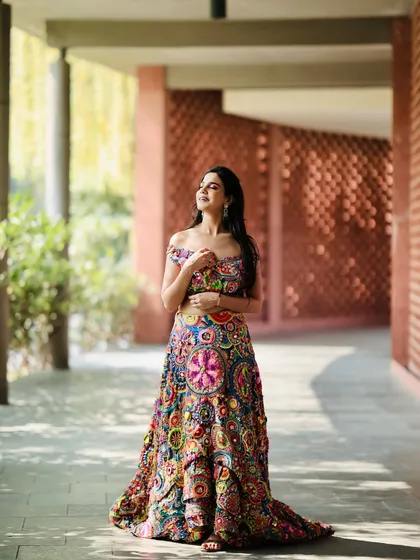This is the kind of energy and look I bring to every shoot. I specialize in making ethnic wear pop, ensuring your brand's designs are showcased with confidence and style. This vibrant, multi-colored lehenga is a perfect example of the Desi Glam I love.