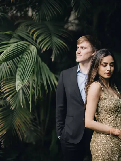 Styling a couple for their cocktail night is about creating a look that is both glamorous and personal. Here, we focused on a timeless sequin saree for her and a sharp, classic suit for him, ensuring they complemented each other perfectly against the lush backdrop.