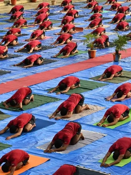 Force One officers practicing Balasana (Child's Pose). This grounding posture is excellent for releasing tension in the back and calming the nervous system, providing a moment of deep rest.
