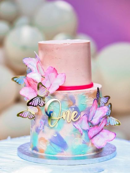 A beautiful two-tiered cake for a first birthday party, decorated with butterflies. I love capturing the details of milestone celebrations, including the all-important birthday cake.
