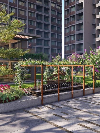 A water feature framed by a pergola adds both visual and auditory tranquility to this residential courtyard, enhancing the sensory experience of the space.