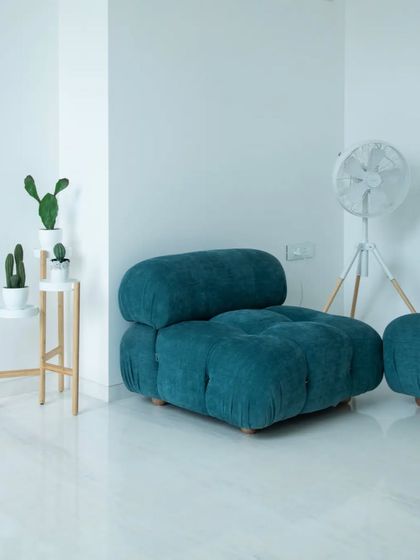 Images from the "Shades of White" project, focusing on how minimalism, light, and subtle details like a curved glass railing or a pop of color from a chair can create a powerful architectural statement.