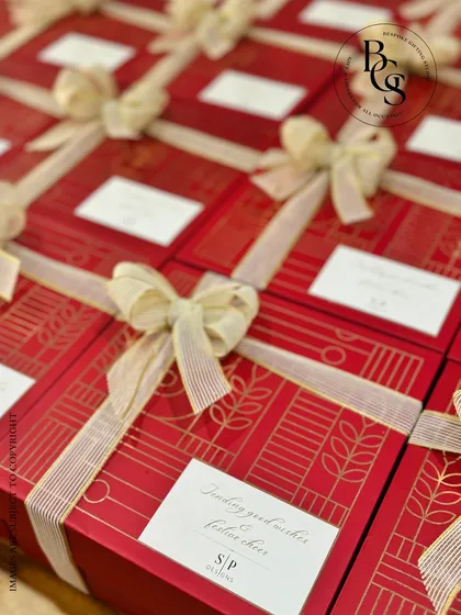 An elegant corporate Diwali order we created for a renowned interior designer. These custom red boxes with gold line-art detail and striped ribbons reflect a sophisticated brand identity, making them a perfect client gift.