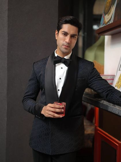 A closer look at the Labyrinth Tuxedo's unique texture and the classic satin shawl lapel.