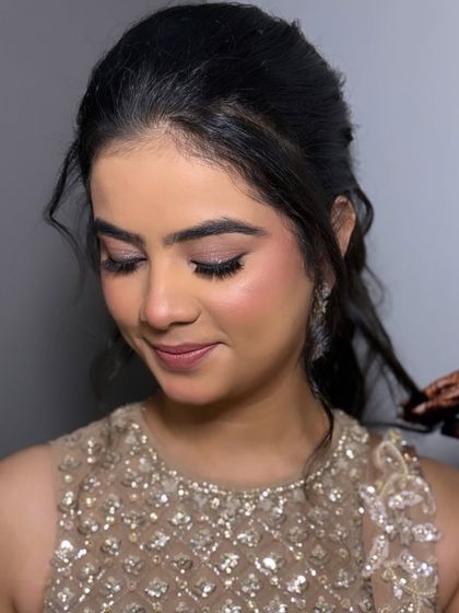 Our "Indian Barbie" look, perfect for a cocktail or reception. The makeup is soft and pretty, with a focus on flawless skin and shimmering eyes, paired with an elegant updo.