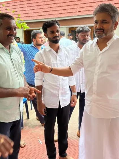 A personal interaction during a community gathering in Hangal. Taking the time to speak with individuals, especially the youth, is essential for building trust and inspiring the next generation of local leaders.