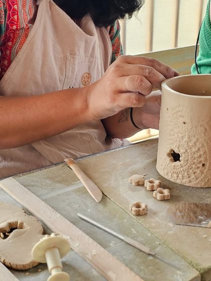 A few snapshots of corporate team members completely absorbed in their creative process. They are making everything from decorative nameplates to unique bowls during our hand-building workshop.