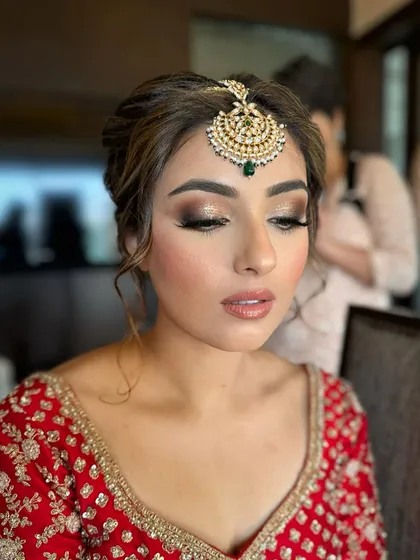 A detailed shot of Jasmeet's eye makeup, showing the seamless blend of colors that create a sultry yet elegant effect.