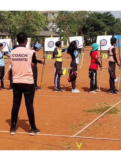 Supervising the Maharashtra team at the national championships. My goal is to ensure they are focused, confident, and ready to perform their best.