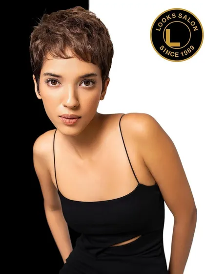A model showcasing a chic, textured pixie cut. This short hairstyle is modern, confident, and easy to manage, highlighting our skill in short haircuts for women.