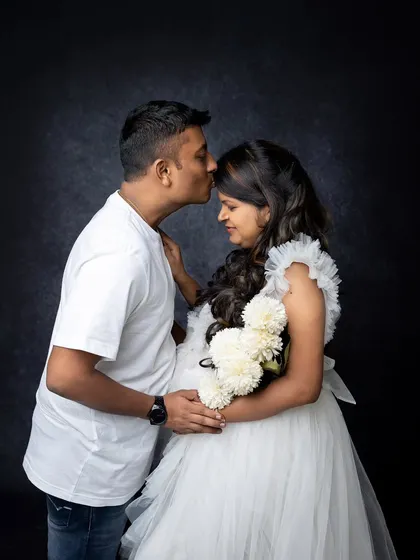 A tender moment between a couple during their maternity session. A gentle kiss on the forehead is a simple yet powerful gesture of love and support that I love to capture.