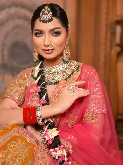 This shot highlights the beautiful details of her jewelry and the way her makeup enhances her features. The look is both traditional and modern.