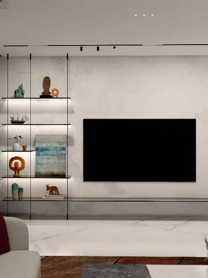 The TV wall in the Gulecha Residence is designed as a clean, integrated feature. Backlit glass shelves provide a light-filled space for decor, while the floating console maintains a sense of spaciousness.