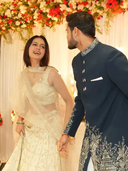 A candid, happy moment on the dance floor. Her makeup remains flawless and radiant.