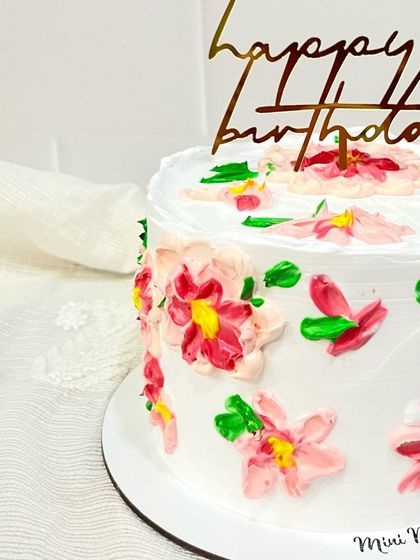 A close-up of the hand-painted floral details. I love how the colors blend together to create a beautiful, impressionistic look on the buttercream canvas.