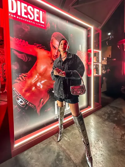 My full look for the Diesel party, featuring silver boots and a denim jacket, perfectly matching the brand's edgy vibe.