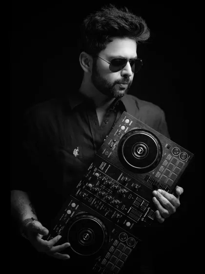 "Music is wild sounds civilized into time and tune." A quote that I live by, captured in this black and white portrait with my controller.