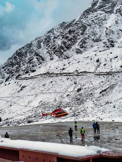 Our pilgrimage to Kedarnath is supported by an entire ecosystem of people. This journey is made possible by the horsewallahs, the helicopter pilots, and the shopkeepers who work in these harsh conditions. This photo captures the modern logistics that support an ancient pilgrimage route.