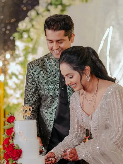 The cake-cutting ceremony, a sweet start to their new life together.