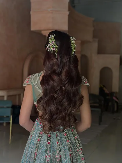 Another shot of the stunning wavy half-updo, showcasing the rich color and healthy shine of the hair. This style is both elegant and effortlessly beautiful.