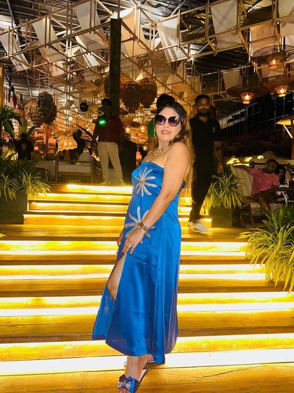 This blue dress is perfect for a party on a vacation. The color and style are just so vibrant.