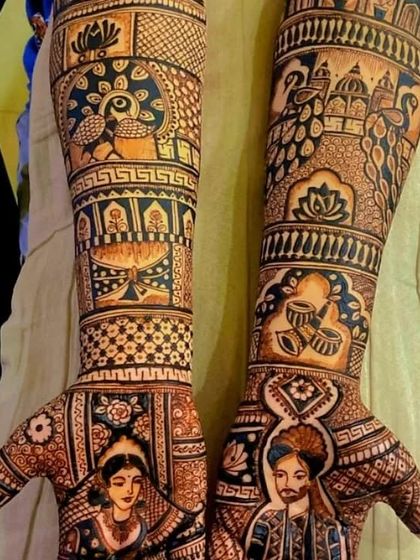 A design with a mix of portraits and traditional motifs like peacocks, drums, and a kalash.