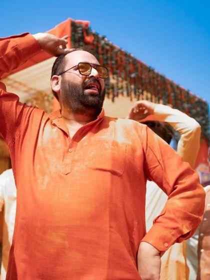 A candid shot of a guest enjoying the music and dancing at the Haldi. These photos of friends and family add to the rich tapestry of the wedding day.